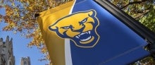 Pitt banner on outdoor light post