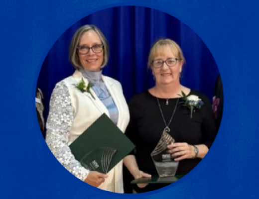 Susan Lucas and Dawna Cerney accepting an award